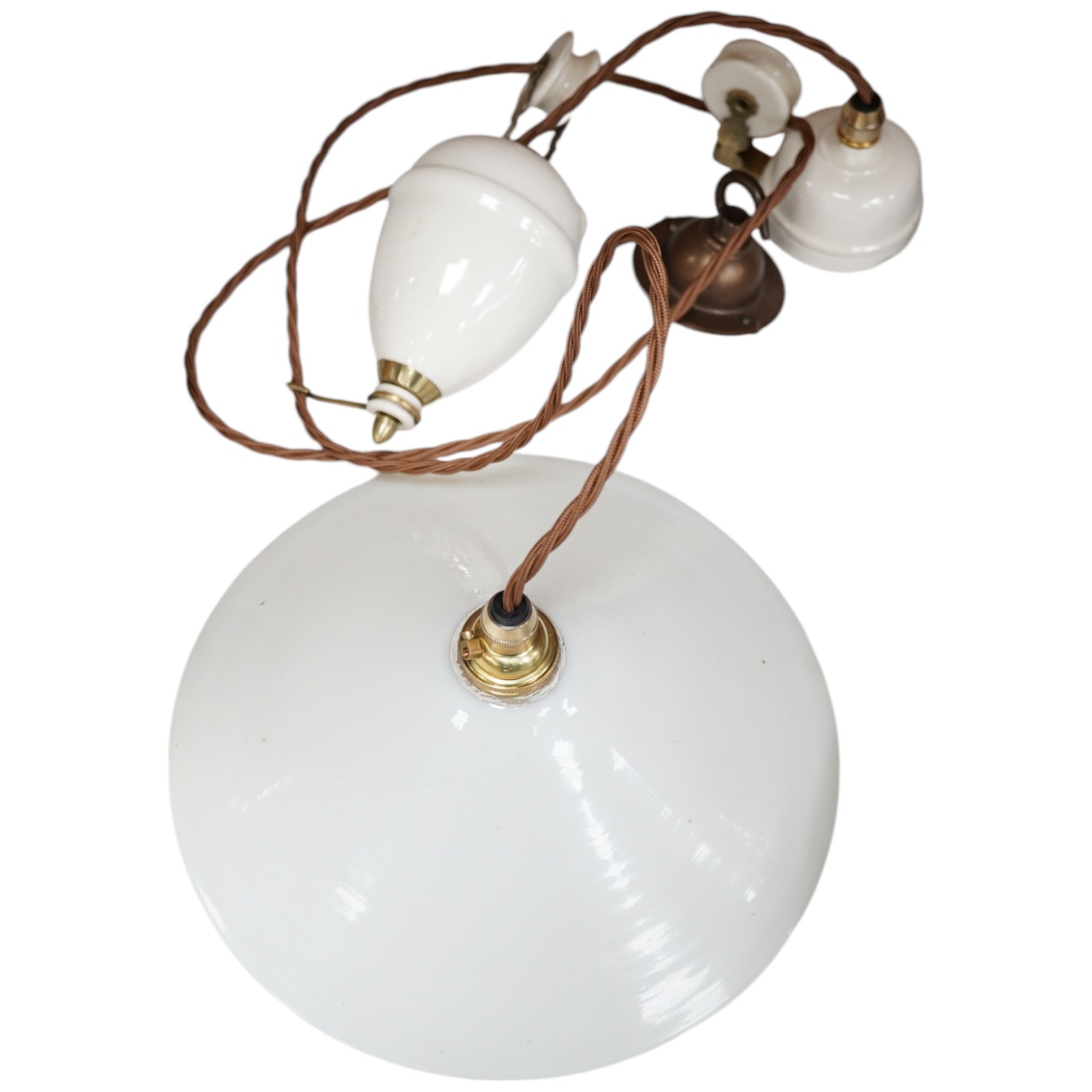 A French ceramic rise and fall ceiling light with opaline coolie shade, circa 1930’s-40’s, wired, overall 68cm high. Condition - good